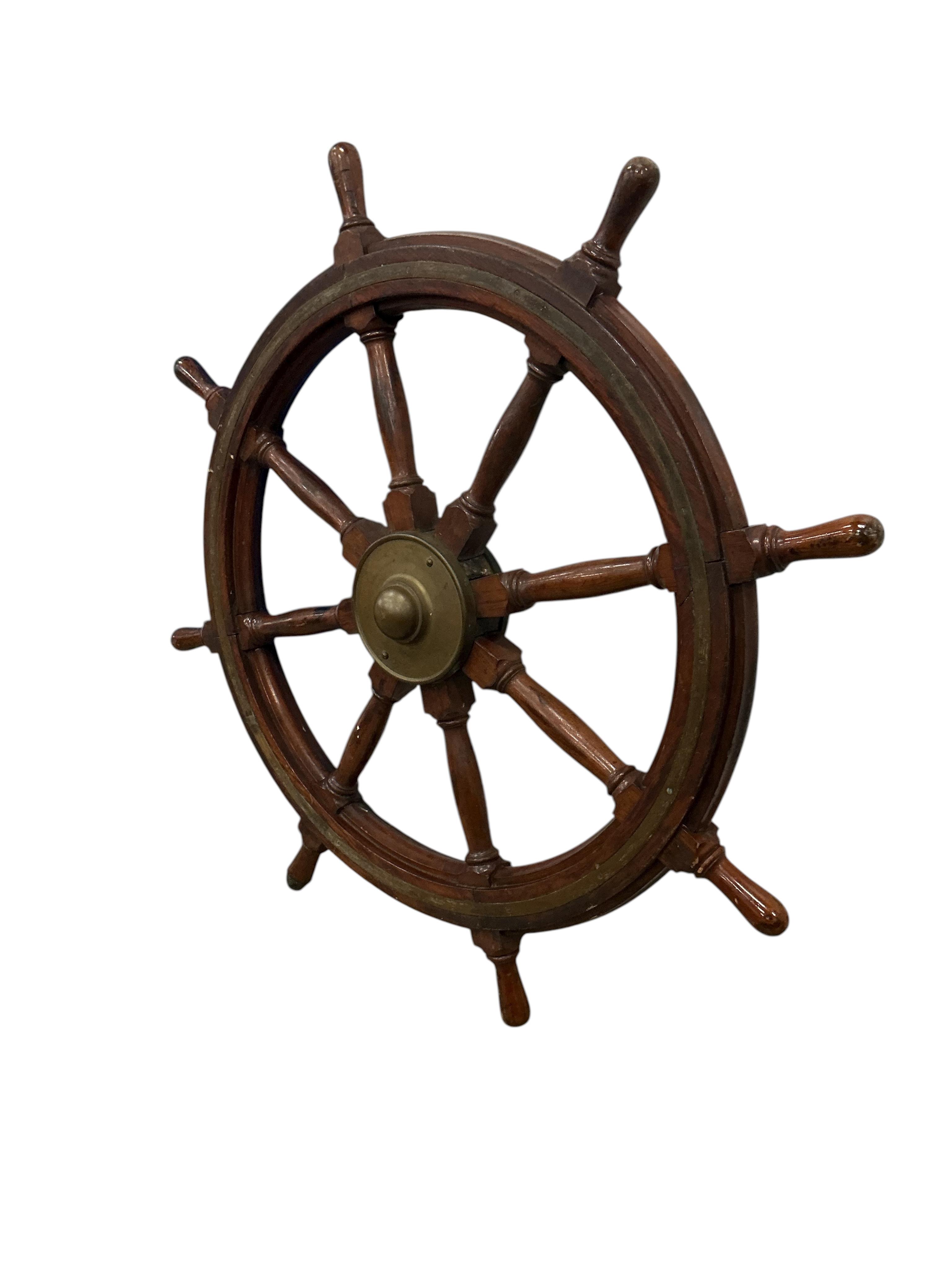 An early 20th century brass mounted teak ships wheel, diameter 114cm